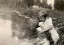 Lesley Dunlop fishing in Cassiobury Park, c1955