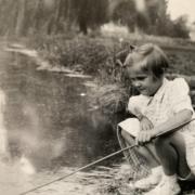 Lesley Dunlop fishing in Cassiobury Park, c1955