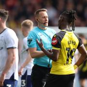 Vakoun Bayo tries to make his point to James Bell during Watford's game with Preston last month