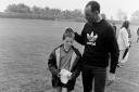The young fan gets a pat on the head from Bruce Grobbelaar