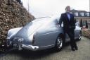 Sir Elton standing next to the 1959 Bentley SI Continental Sport Saloon he used to own