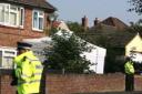 Police at the scene of the triple murder in Bishop's Stortford