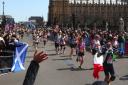 Runners making their way past Big Ben as part of the London Marathon yesterday