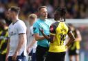 Vakoun Bayo tries to make his point to James Bell during Watford's game with Preston last month
