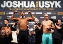 Anthony Joshua and Oleksandr Usyk at today's weigh-in. Picture: PA