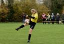 Matilda Walker volleying home for the U16 Warriors against Harpenden Colts in the County Cup.