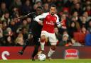 Domingos Quina challenges former Arsenal attacker Theo Walcott. Picture: Action Images