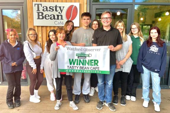 Watford Observer: Co-directors Jerome and Jayne Enskat (Fourth and Third from R) with the Tasty Bean Cafe team last year. Watford Observer: Co-directors Jerome and Jayne Enskat (Fourth and Third from R) with the Tasty Bean Cafe team last year.