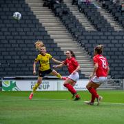 Poppy Wilson heads home the only goal of the game.