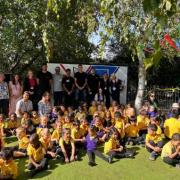 Football players unveil new art mural in primary school