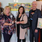 Brian Cowan, Louise Welland, Sumi Watters, Mick Callanan and Aga Dychton in front of Louise's winning collage