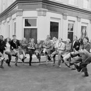 The EastEnders cast enjoying a knees up in front of what would become the Queen Vic