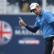 In the groove: leader Richard Bland celebrates his birdie on 18. Picture: Action Images