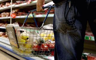 A shopping basket in a supermarket (Julien Behal/PA)