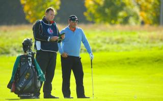 Weighing up their options: John Glenn and Justin Walters discuss a shot during the British Masters.