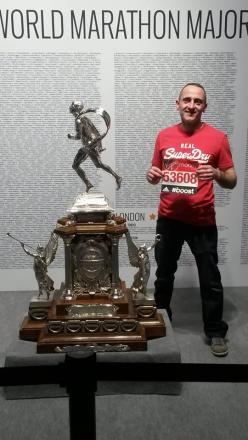 Tim Dennis collects his race number for London Marathon