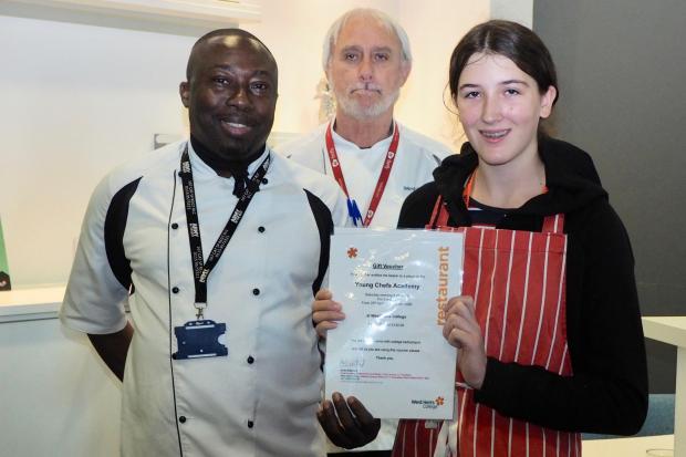 Watford Girls' Grammar pupil Gemma MacManus with chef Pedro Carmichael and Herts College head of catering Andy Wakeford. Photo: David Silverston