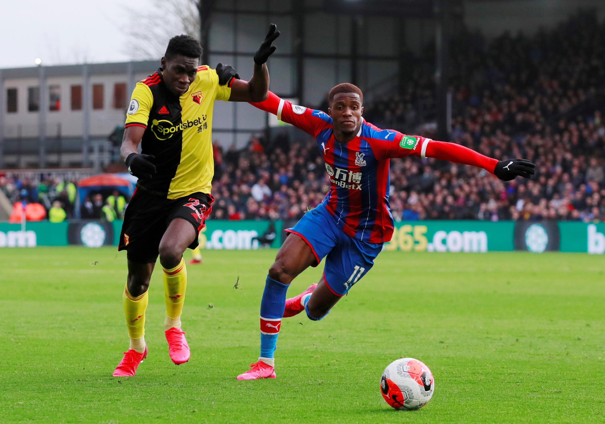 Soccer Football - Premier League - Crystal Palace v Watford - Selhurst Park, London, Britain - March 7, 2020 Watfords Ismaila Sarr in action with Crystal Palaces Wilfried Zaha Action Images via Reuters/Andrew Couldridge EDITORIAL USE ONLY. No us