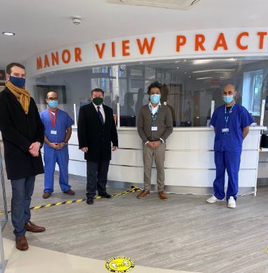 Peter Taylor, left, and Dean Russell, centre left, with staff from Manor View Practice