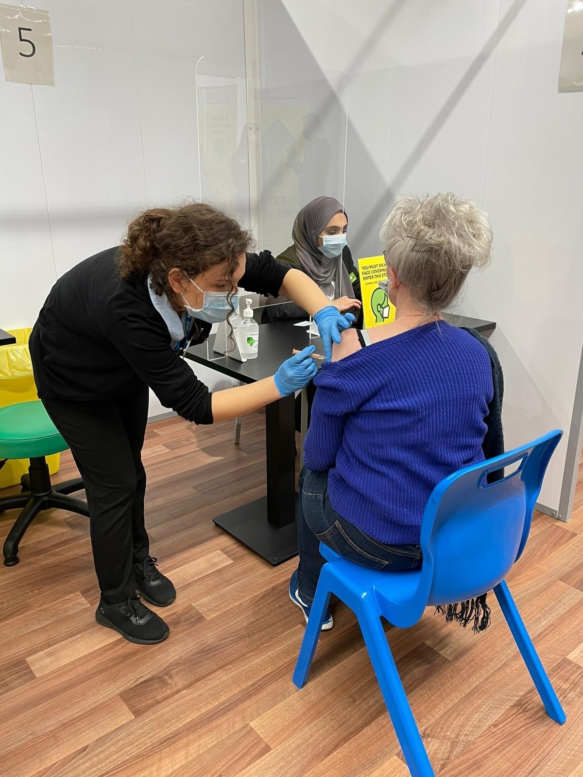Another patient receives the Covid jab from a trained member of Asdas pharmacy team. Credit: Asda