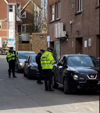 Police officers speaking to drivers who illegally used the High Street and King Street. Credit: Watford Police