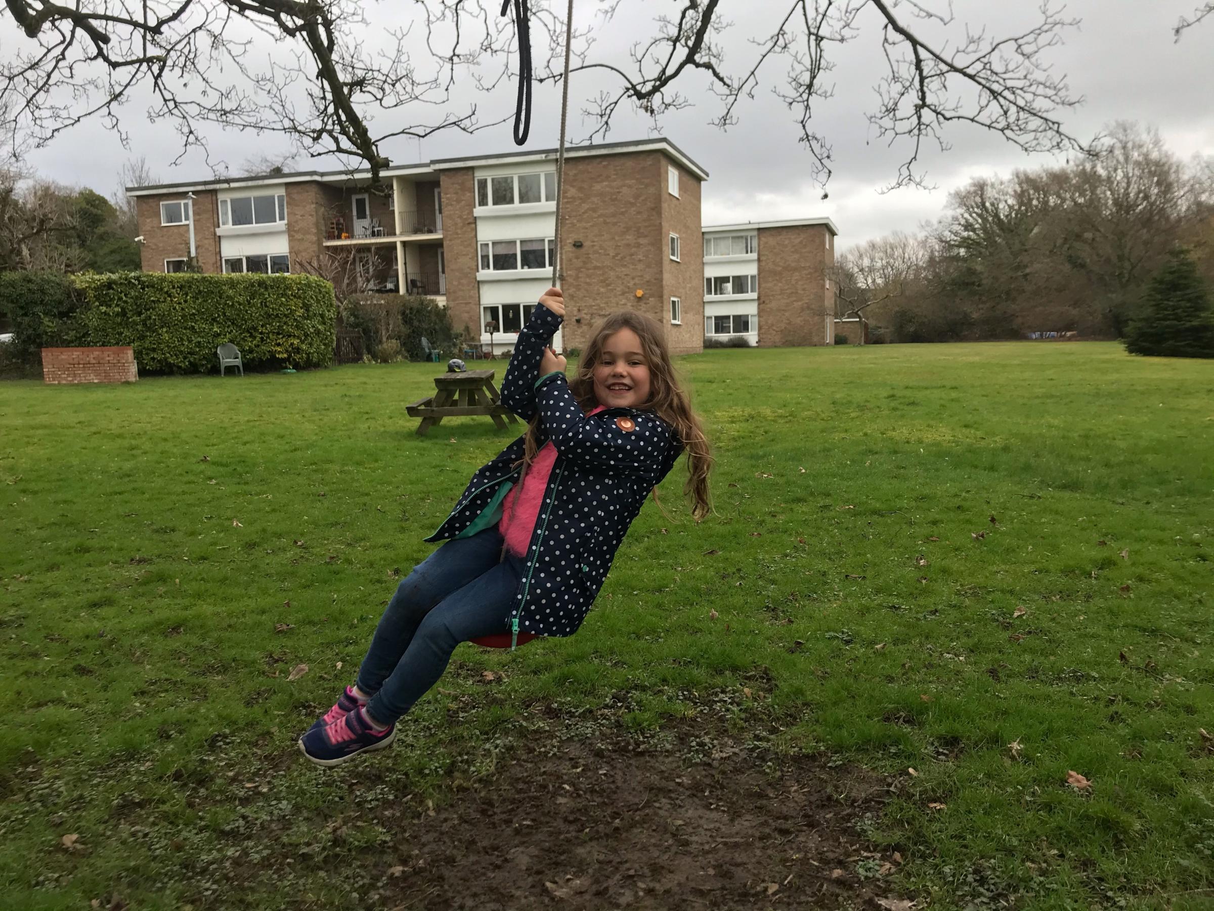 Imogen Cox playing on the swing near her uncle Jonathans home in Sycamore Road, Croxley Green