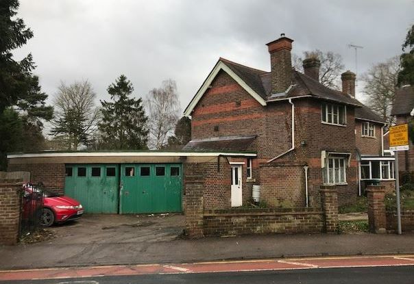 This green garage would have been demolished has plans in 2019 been passed. Credit: Network Auctions