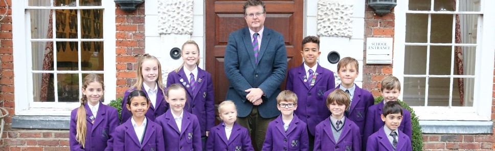 Headmaster Jon Gray pictured with pupils