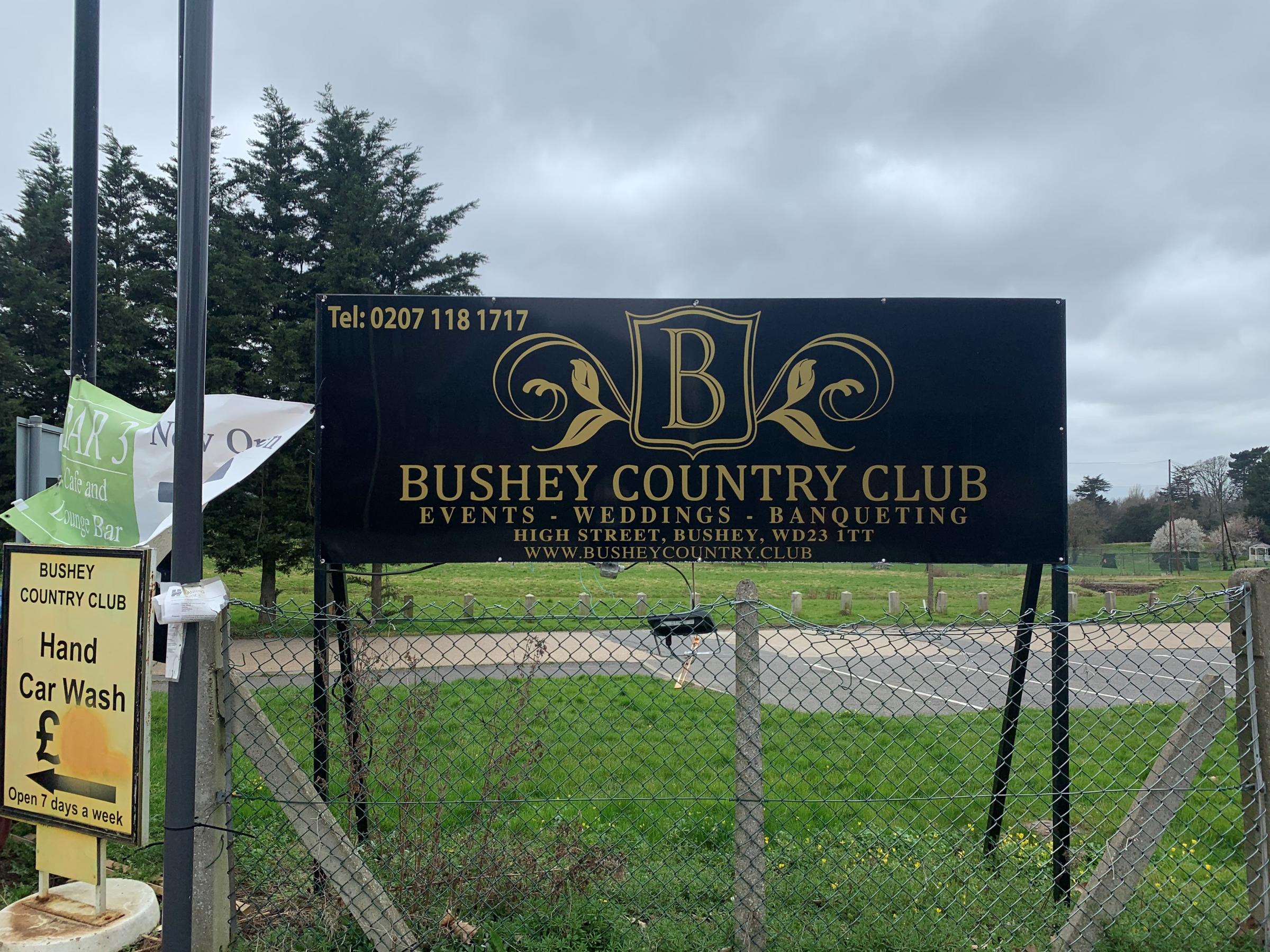 A Bushey Country Club sign by the entrance to the site