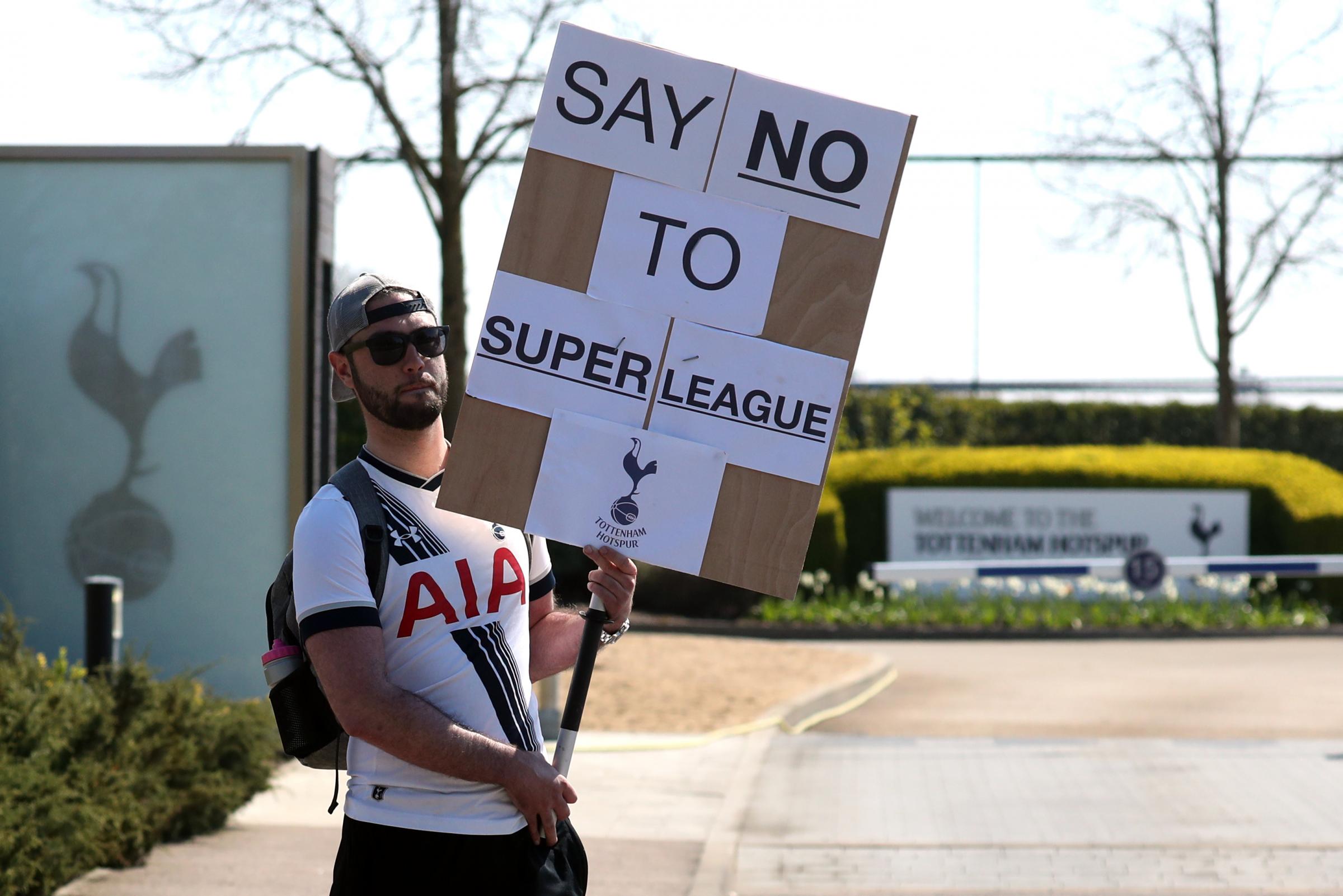 A Tottenham fan also protested the Super League proposal outside the clubs training ground. Credit: PA