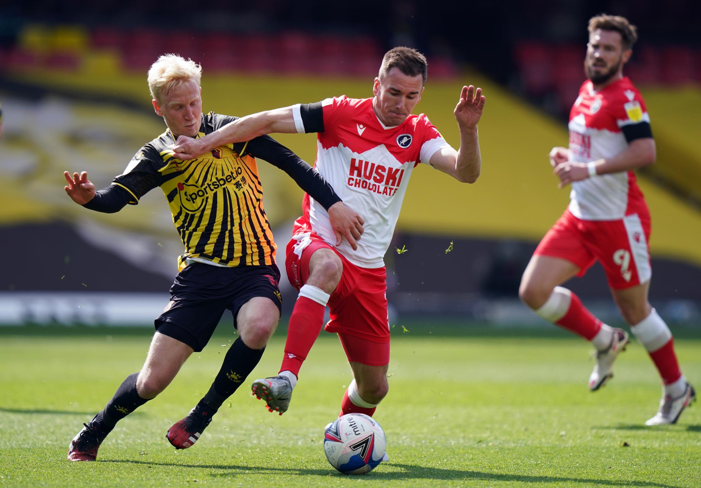 Will Hughes and Millwalls Jed Wallace (right) battle for the ball. Photo: PA