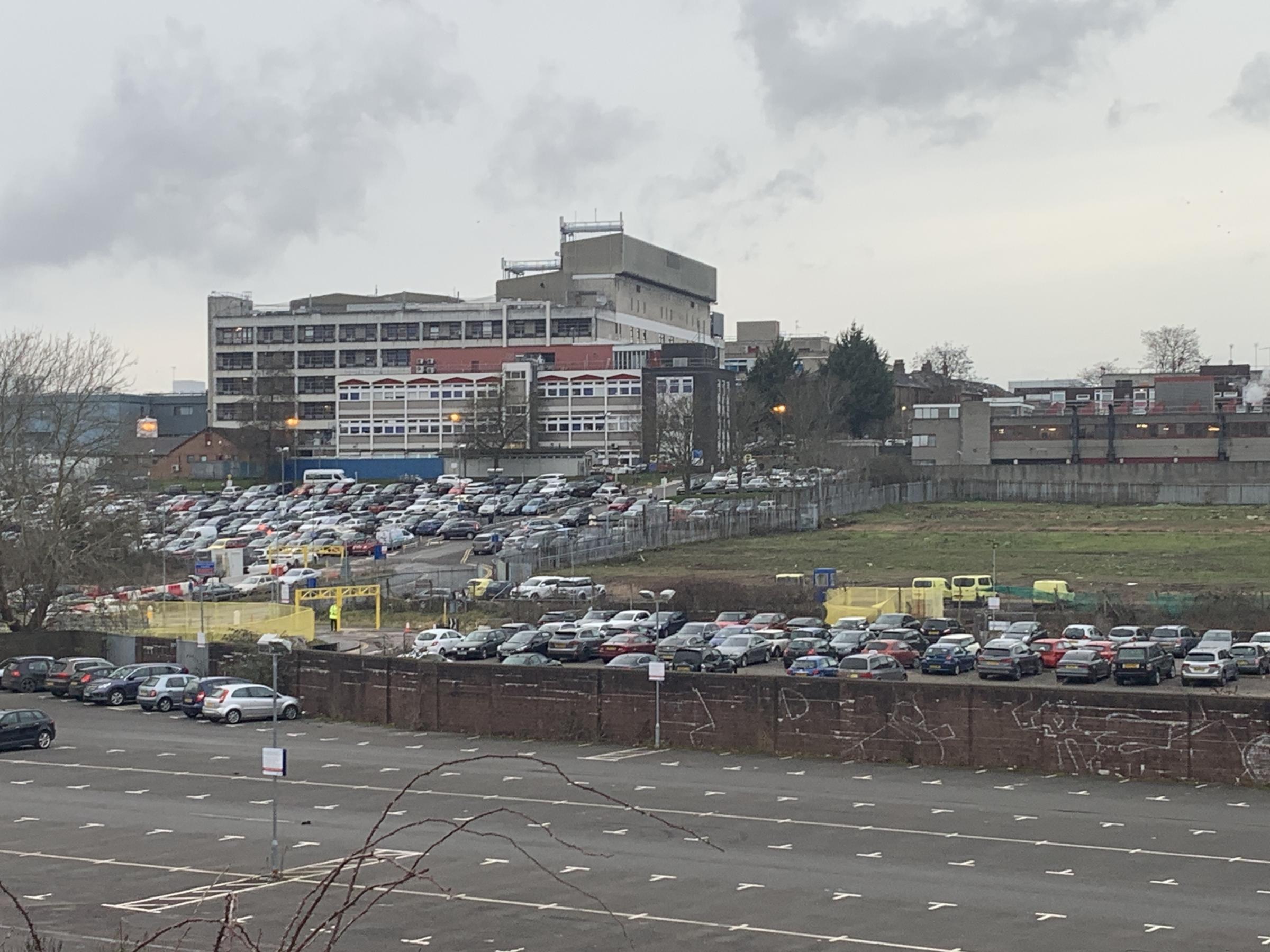 A file photo taken of the current main car park at Watford General with the hospital in the background