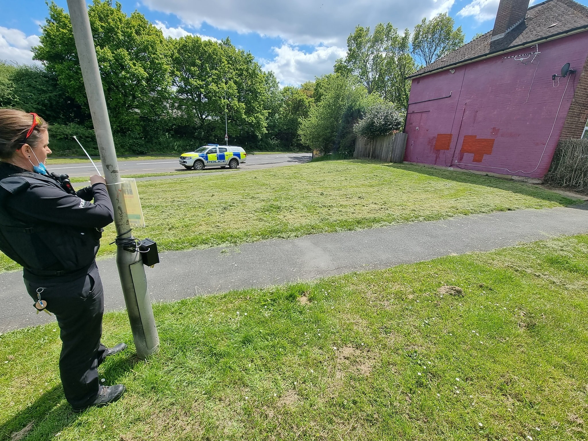 Police installing the camera in Prestwick Road. The pink wall is where graffiti appeared. Credit: Three Rivers Police