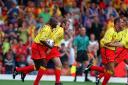 Michel Ngonge celebrates a goal with Peter Kennedy. Picture: Action Images