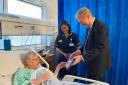 Oliver Dowden with ward manager and senior sister Saritha Jagannatham meeting a patient