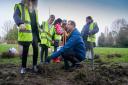 Watford mayor Peter Taylor helping children plant trees