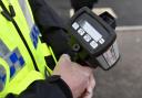 Speed gun held by police officer stock image.