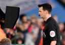 Referee Andy Madley refers to the VAR monitor. Picture: Action Images