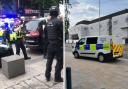 Three men have been charged after a man was allegedly cut in a group fight in High Street, Watford, on August 16. A scientific services unit was called to the scene after a reported stabbing on August 14 Credit: @999Herts, Kimberley Hackett