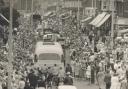 Crowds line St Albans Road to watch the carnival parade in the 1950s. Image: Watford Museum