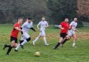Division One leaders Watford Sports (red shirts) were held to a draw for a second week running