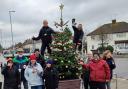 Volunteers decorate Christmas Tree on Goodwood Parade in Courtlands Drive, North Watford