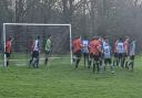 Getting set for a corner in Watford Sports' (red shirts) victory over The Cross