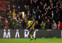 Emmanuel Dennis somersaults to celebrate giving Watford the lead
