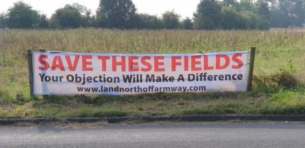 Watford Observer: A banner calling for fields off Farm Way in Bushey to be saved from housing development