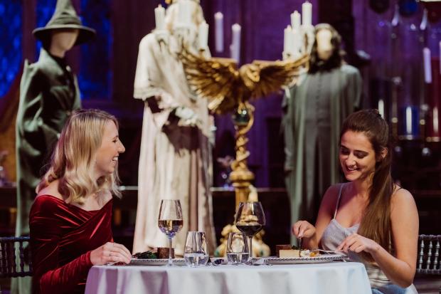 Watford Observer: A couple enjoying a valentine's dinner in the Great Hall. Credit: Warner Bros. Studio Tour London – The Making of Harry Potter.