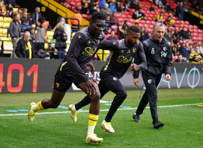 Ismaila Sarr, left, warming up for Watford alongside Nigerian forward Emmanuel Dennis. Both have been involved in AFCON selection rows. Credit: PA
