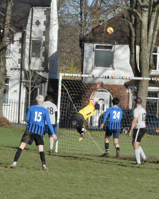 The Southern Cross keeper makes a fine save in his side's victory over BBFC in Division Three. Pictures: Len Kerswill