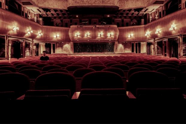 Watford Observer: Rows of empty red theatre seats. Credit: Canva