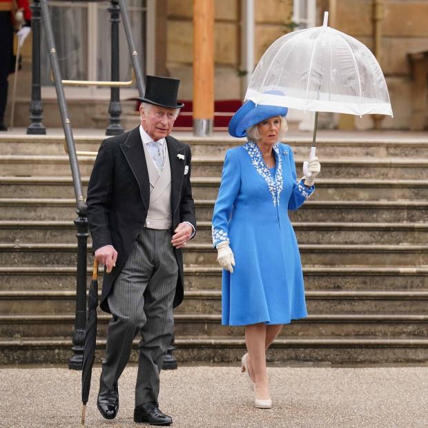 Watford Observer: The Prince of Wales and the Duchess of Cornwall during a Royal Garden Party at Buckingham Palace. Picture: PA